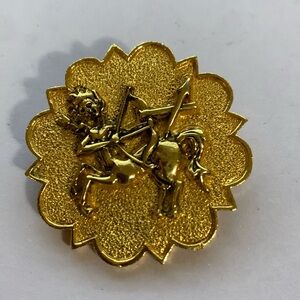 Gold tone Sagittarius brooch